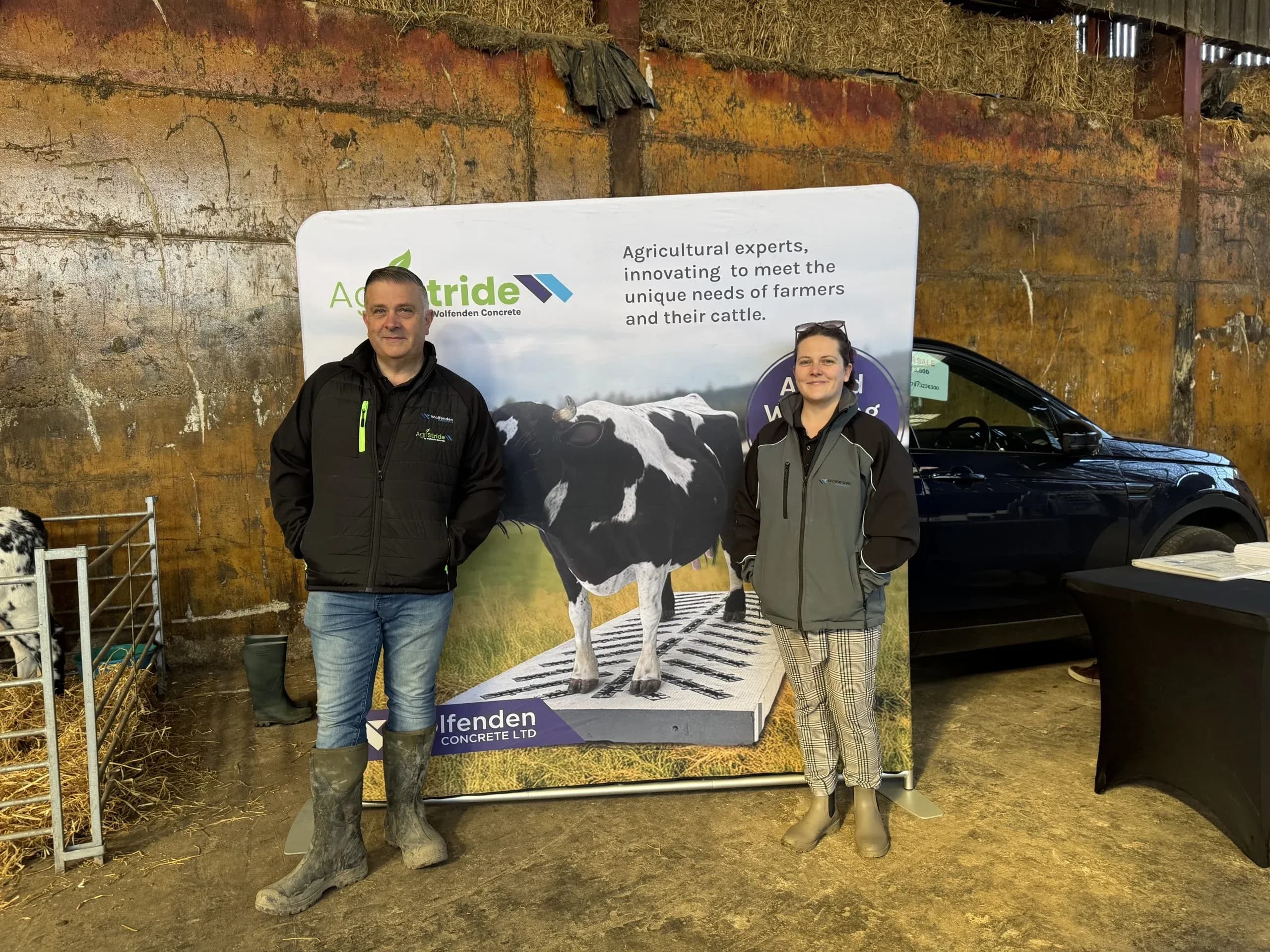 Richard and Jade Moody standing infront of AgriStride banner
